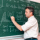 Teacherwriteontheblackboardandexplainalessonimage